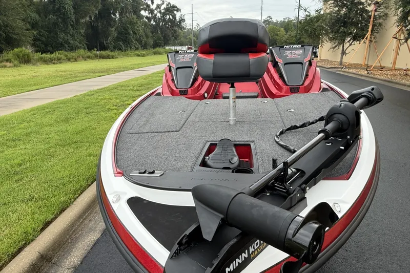 Slide: The Image of 2027 Nitro Z18 XL boat with Minn Kota trolling motor on a paved road. - 3