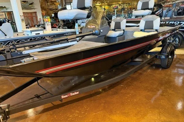 The Image of 2027 Tracker Bass Tracker Classic XL boat displayed in showroom, featuring sleek black design. - 0