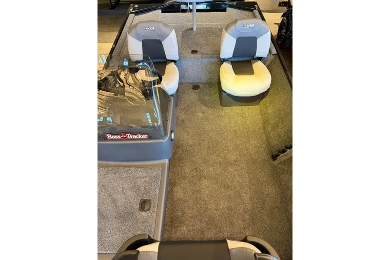 Slide: The Image of 2027 Tracker Bass Tracker Classic XL boat interior with seating and carpeted floor. - 15