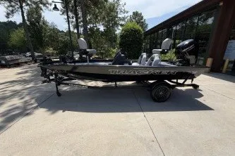 The Image of 2027 Tracker Pro Team 175 boat parked outdoors on a sunny day. - 0