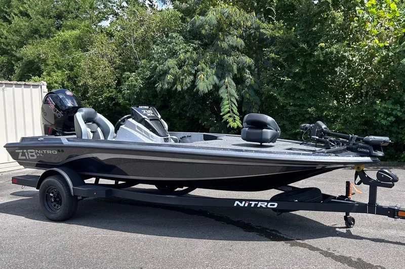 Slide: The Image of 2027 Nitro Z18 XL Pro fishing boat on trailer, parked outdoors. - 1