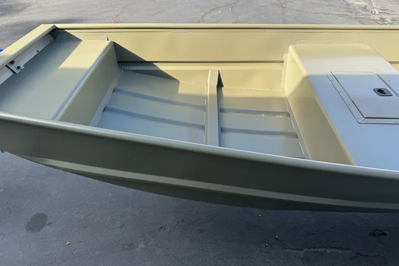 Slide: The Image of 2027 Tracker Grizzly 15 Jon boat interior, showcasing spacious seating and storage compartments. - 24