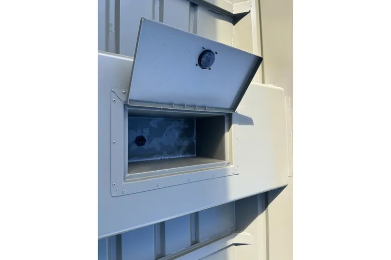 Slide: The Image of Open storage compartment on 2027 Tracker Grizzly 15 Jon boat. - 25