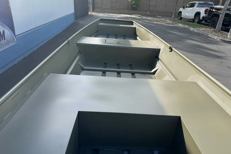 Slide: The Image of 2027 Tracker Grizzly 15 Jon boat interior, showcasing spacious seating and storage areas. - 21