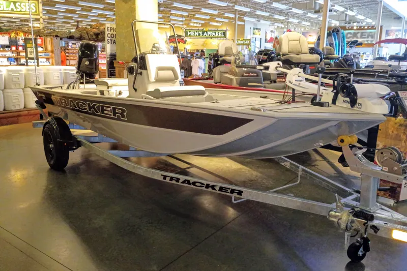 The Image of 2027 Tracker Bass Tracker Classic CC boat displayed in a showroom, featuring sleek design and modern equipment. - 0