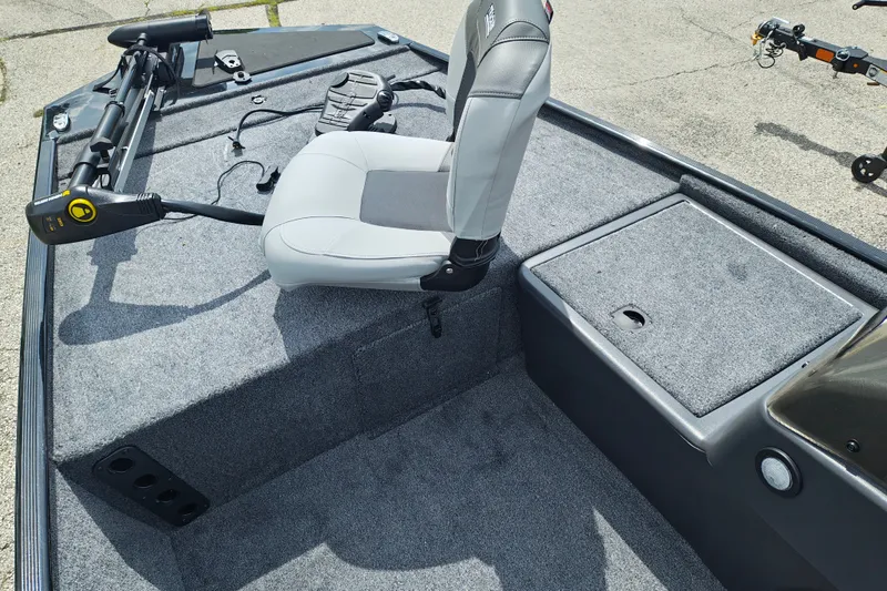 Slide: The Image of 2027 Tracker Bass Tracker Classic XL boat interior with gray seating and carpeted deck. - 15