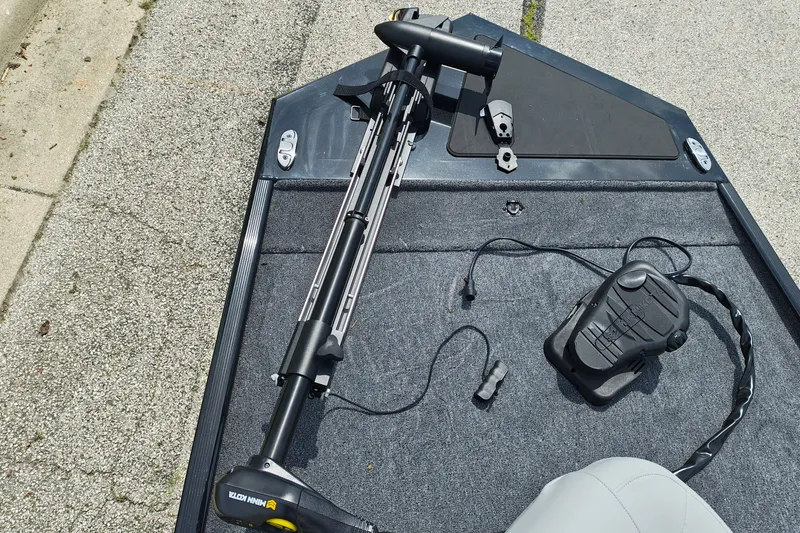 Slide: The Image of 2027 Tracker Bass Tracker Classic XL boat deck with trolling motor and foot pedal. - 18