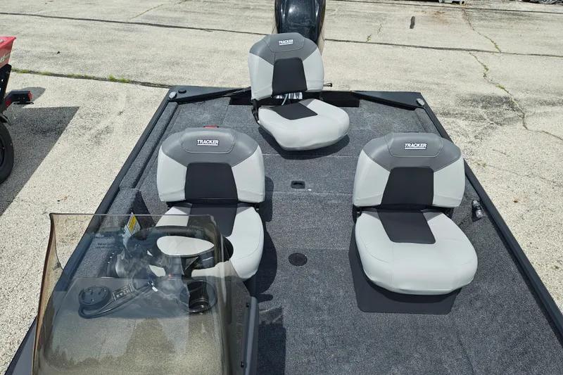 Slide: The Image of 2027 Tracker Bass Tracker Classic XL boat interior with gray seating and steering console. - 20