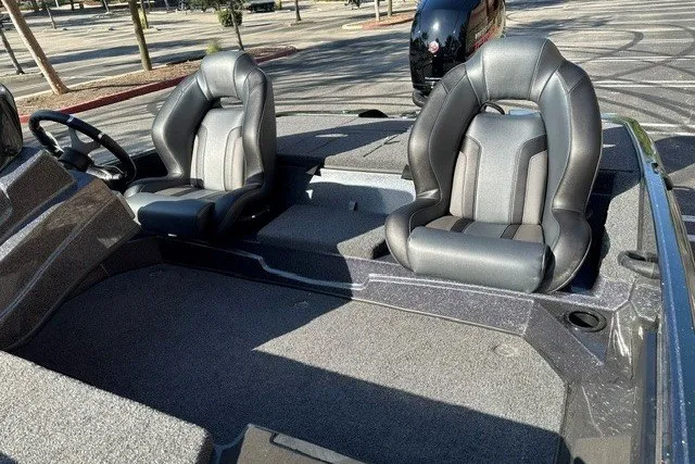 Slide: The Image of 2027 Nitro Z18 XL boat interior with two sleek, cushioned seats and steering wheel. - 9