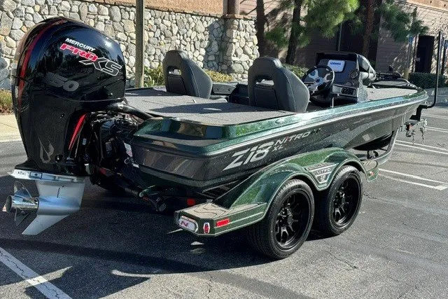 Slide: The Image of 2027 Nitro Z18 XL boat with Mercury Pro XS engine in a parking lot. - 5