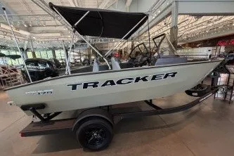 The Image of 2027 Tracker Pro Guide V-175 Combo boat displayed indoors on a trailer. - 0