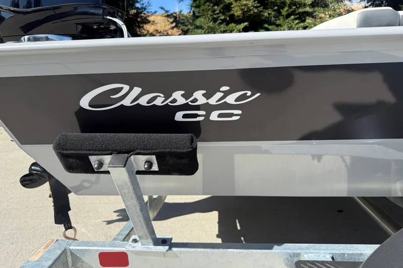 Slide: The Image of 2027 Tracker Bass Tracker Classic CC boat detail with logo and trailer. - 19