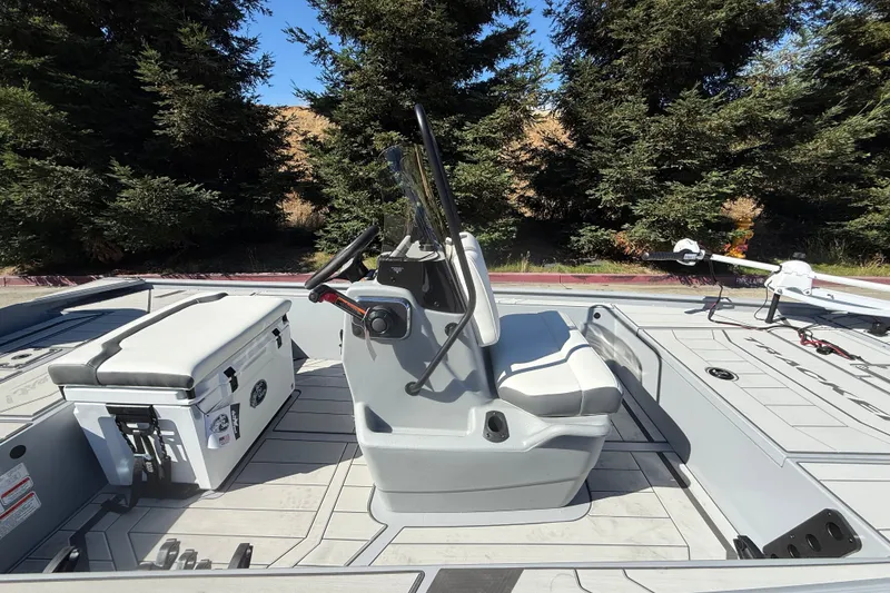 Slide: The Image of 2027 Tracker Bass Tracker Classic CC boat interior with steering console and seating. - 17