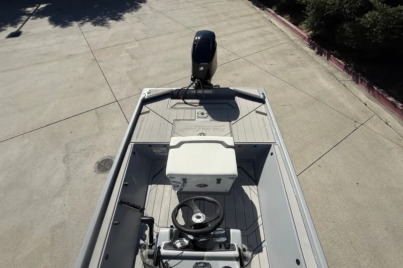Slide: The Image of 2027 Tracker Bass Tracker Classic CC boat, top view of steering console and deck. - 14