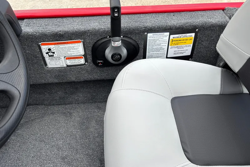 Slide: The Image of Interior of 2027 Tracker Bass Tracker Classic XL boat with steering and seating details. - 18