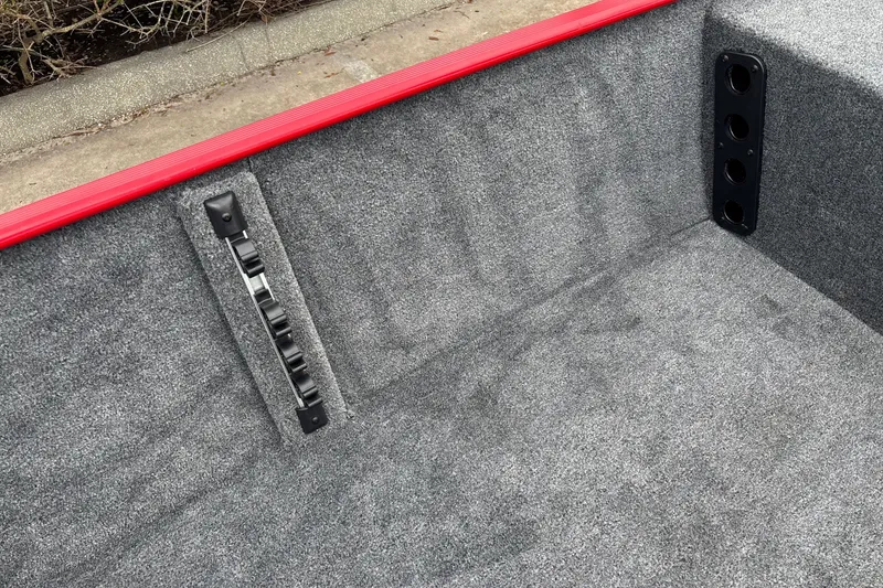 Slide: The Image of Interior of 2027 Tracker Bass Tracker Classic XL boat with gray carpet and red trim. - 13