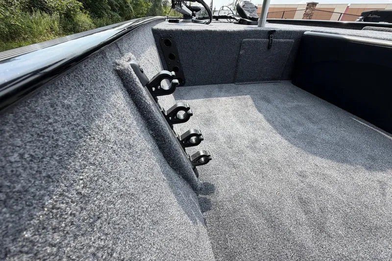 Slide: The Image of Interior of 2027 Tracker Bass Tracker Classic XL boat with rod holders and carpeted flooring. - 16