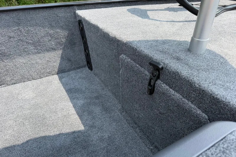 Slide: The Image of 2027 Tracker Bass Tracker Classic XL boat interior with gray carpeted storage area. - 20