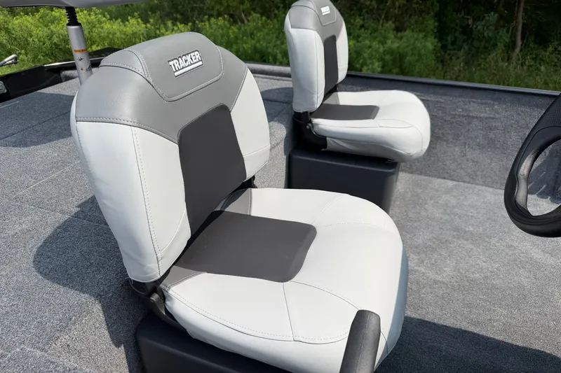 Slide: The Image of 2027 Tracker Bass Tracker Classic XL boat seats, gray and white upholstery, outdoor setting. - 13