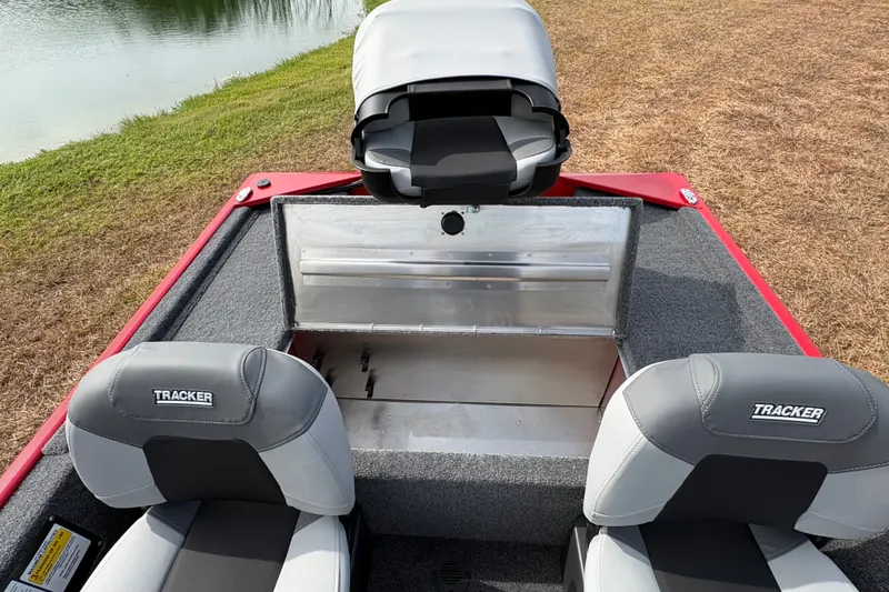 Slide: The Image of 2027 Tracker Bass Tracker Classic XL boat interior with seating and storage compartment. - 86