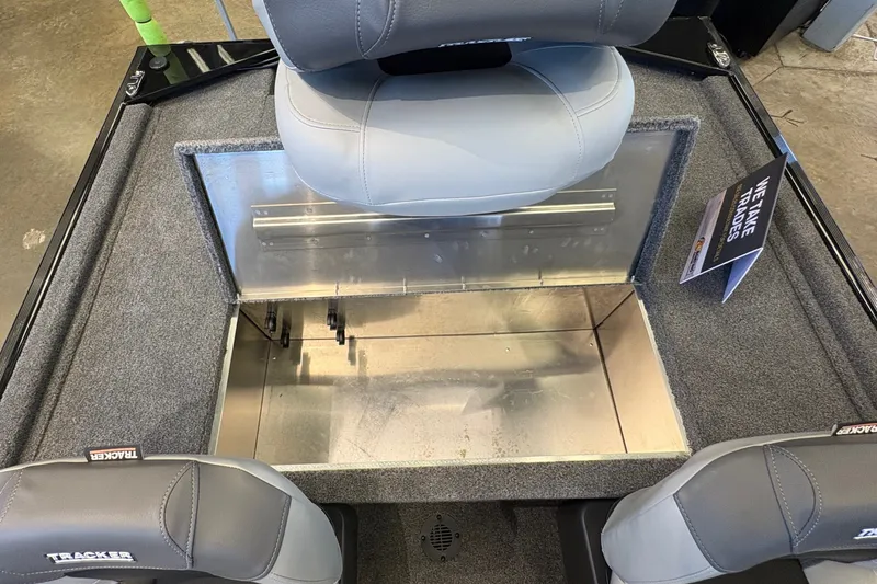Slide: The Image of 2027 Tracker Bass Tracker Classic XL boat interior with gray seating and storage compartment. - 21