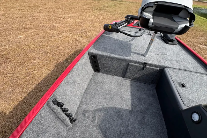 Slide: The Image of 2027 Tracker Bass Tracker Classic XL boat interior with seating and carpeted deck. - 89