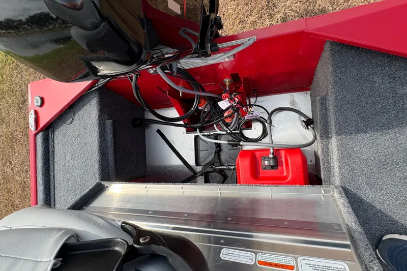 Slide: The Image of 2027 Tracker Bass Tracker Classic XL boat interior with engine and fuel tank. - 88