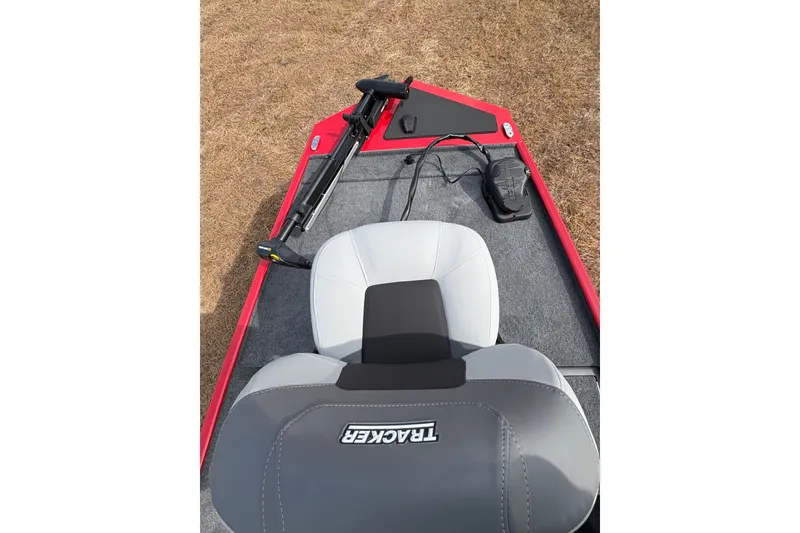 Slide: The Image of 2027 Tracker Bass Tracker Classic XL boat interior with seat and trolling motor. - 82
