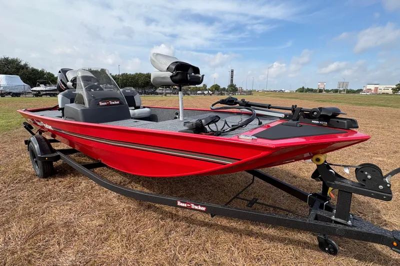 Slide: The Image of 2027 Tracker Bass Tracker Classic XL boat in vibrant red on a trailer. - 80