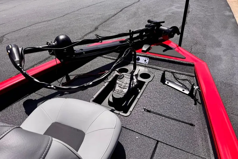 Slide: The Image of 2027 Tracker Pro Team 175 boat interior with steering controls and seating. - 13
