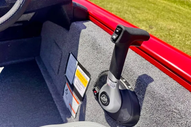 Slide: The Image of Throttle control of 2027 Tracker Pro Team 175 boat, featuring ergonomic design and control labels. - 16