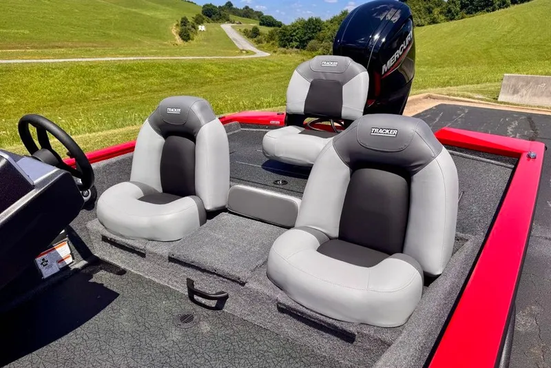 Slide: The Image of 2027 Tracker Pro Team 175 boat interior with gray seats and Mercury engine. - 21