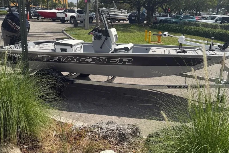 The Image of 2027 Tracker Bass Tracker Classic CC boat on trailer in parking lot. - 0
