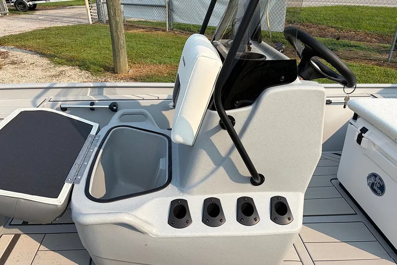 Slide: The Image of 2027 Tracker Bass Tracker Classic CC boat interior with seating and storage compartments. - 17