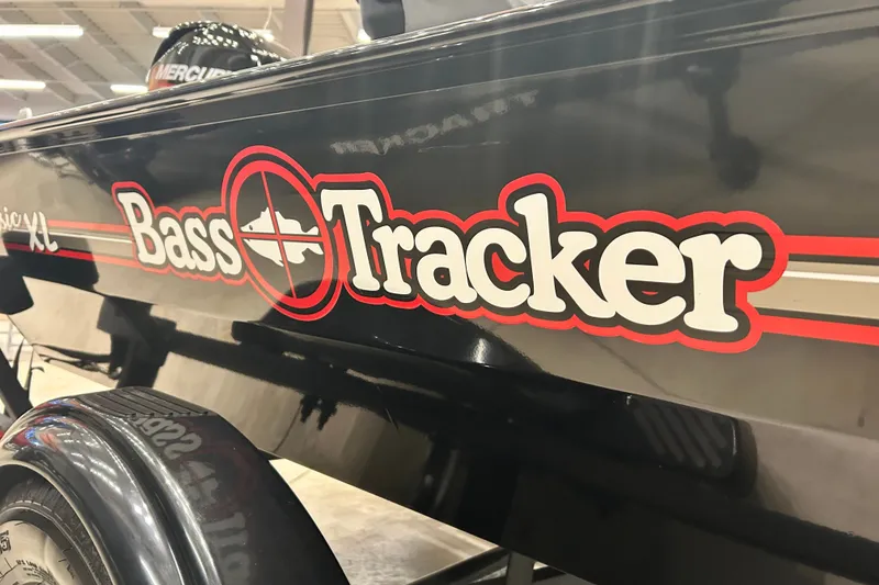 Slide: The Image of 2027 Tracker Bass Tracker Classic XL boat logo on black exterior. - 13