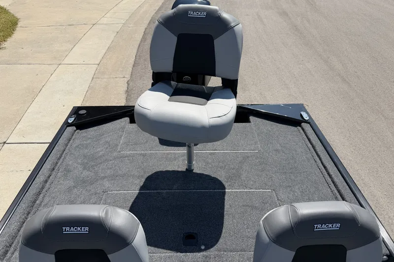 Slide: The Image of 2027 Tracker Bass Tracker Classic XL boat seats on a carpeted deck. - 17