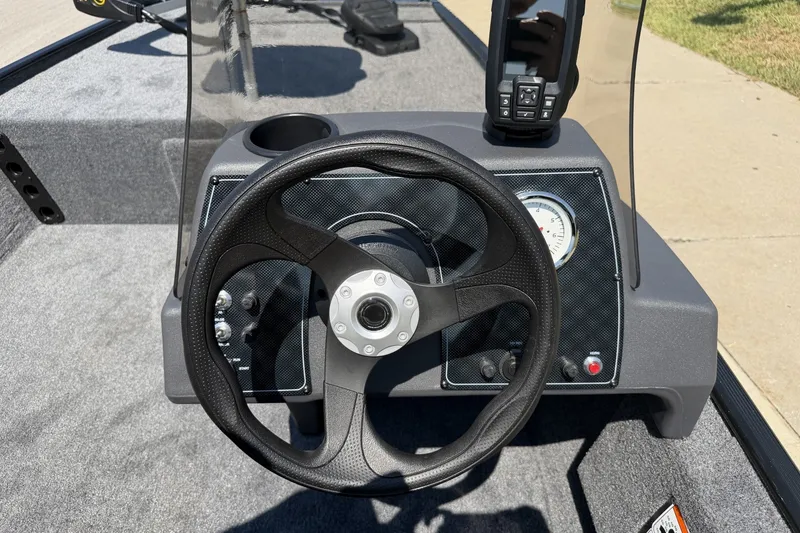 Slide: The Image of Steering console of 2027 Tracker Bass Tracker Classic XL boat with gauges and controls. - 16