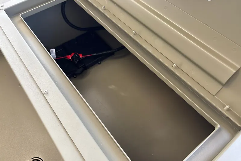 Slide: The Image of Open storage compartment in 2027 Tracker Grizzly 1654 T Sportsman boat. - 20