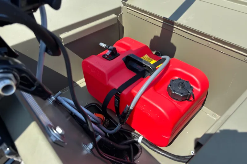 Slide: The Image of Red fuel tank in 2027 Tracker Grizzly 1654 T Sportsman boat interior. - 21