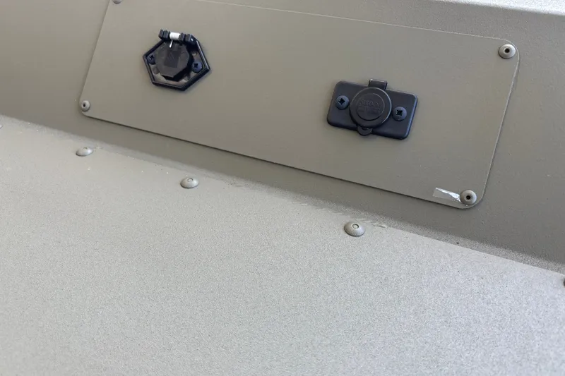 Slide: The Image of 2027 Tracker Grizzly 1654 T Sportsman boat detail showing electrical panel and connectors. - 16
