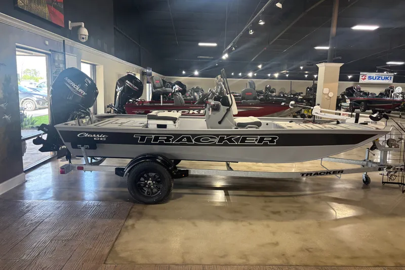 The Image of 2027 Tracker Bass Tracker Classic CC boat displayed in showroom with Mercury engine. - 0