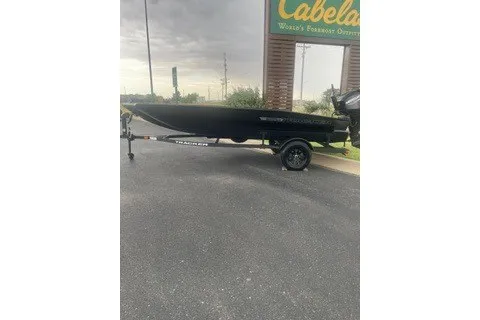The Image of 2027 Tracker Grizzly 1756 T Marsh boat on trailer outside Cabela's store. - 0