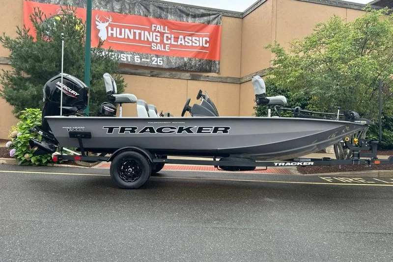 The Image of 2027 Tracker Pro Team 175 boat on trailer, displayed at fall hunting sale event. - 0