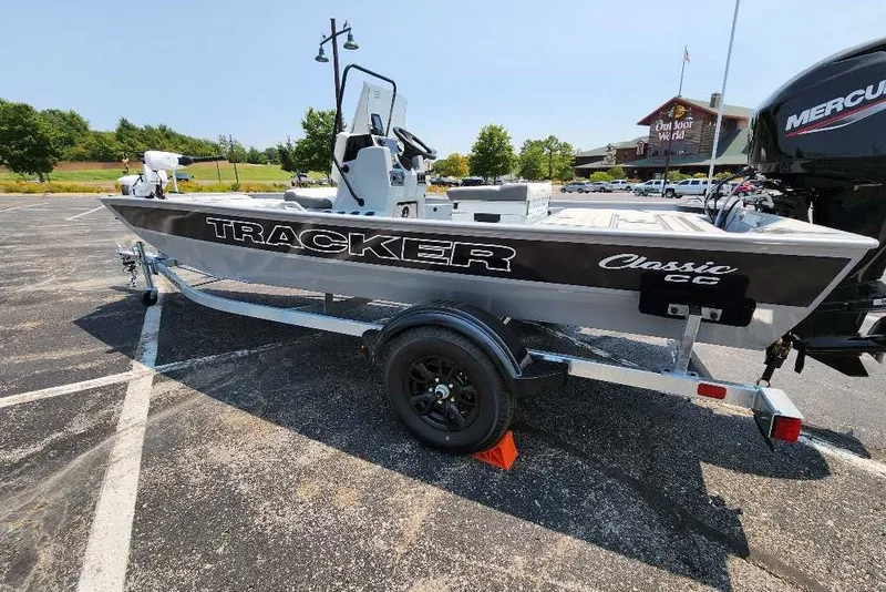 Slide: The Image of 2027 Tracker Bass Tracker Classic CC boat on trailer in parking lot. - 14