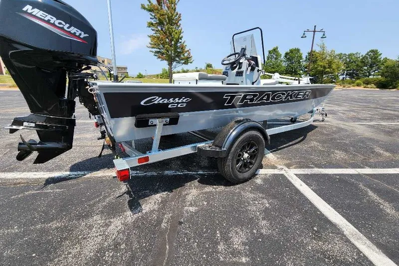 Slide: The Image of 2027 Tracker Bass Tracker Classic CC boat on trailer in parking lot. - 15