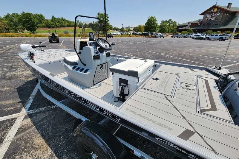 Slide: The Image of 2027 Tracker Bass Tracker Classic CC boat in parking lot, showcasing sleek design and modern features. - 16