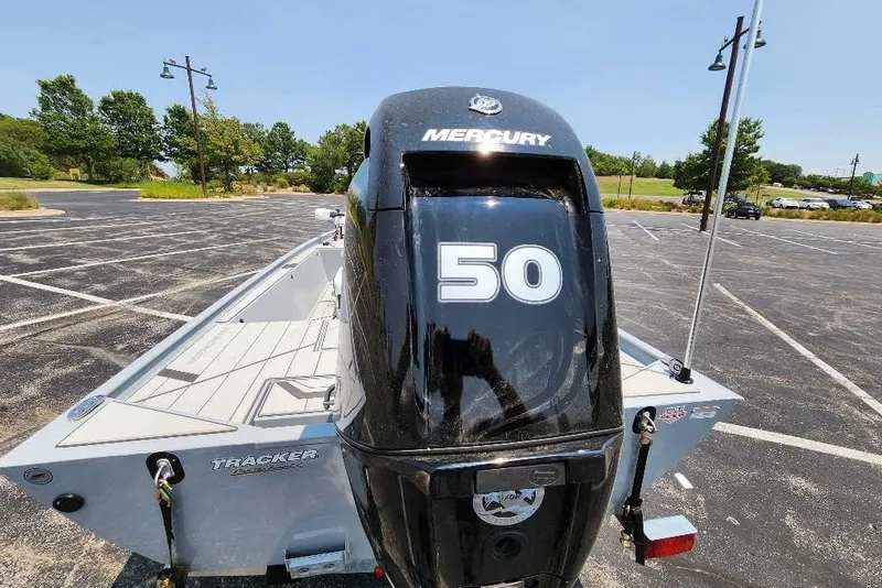 Slide: The Image of 2027 Tracker Bass Tracker Classic CC with Mercury 50 engine in parking lot. - 13