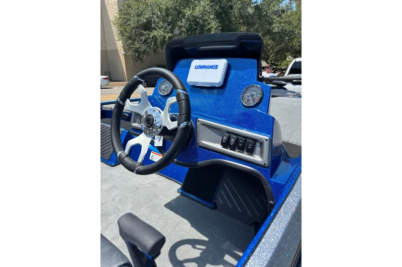 Slide: The Image of 2027 Nitro Z18 XL boat dashboard with steering wheel and Lowrance display. - 3
