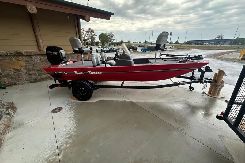 Slide: The Image of 2027 Tracker Bass Tracker Classic XL boat on trailer, parked outdoors. - 59