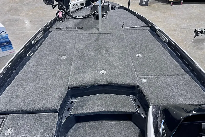 Slide: The Image of 2026 Skeeter FXR20 boat deck with gray carpet and storage compartments. - 4
